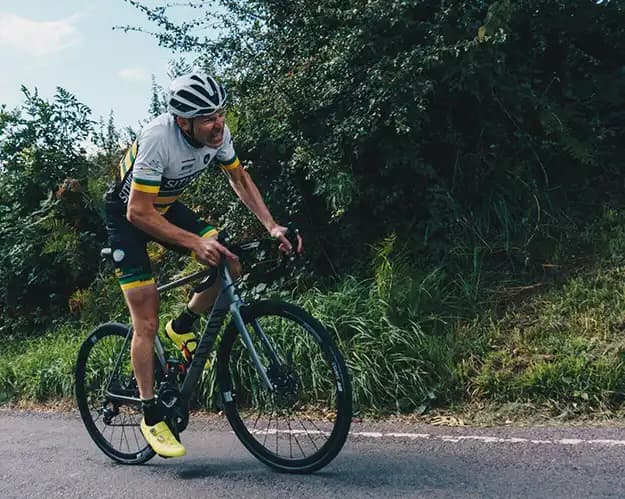A photograph of Club member Joe Srike racing up Ulley Lane