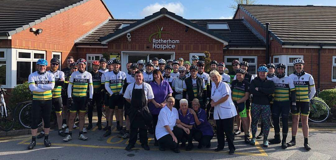 A landscape photograph of Club members outside Rotherham Hospice