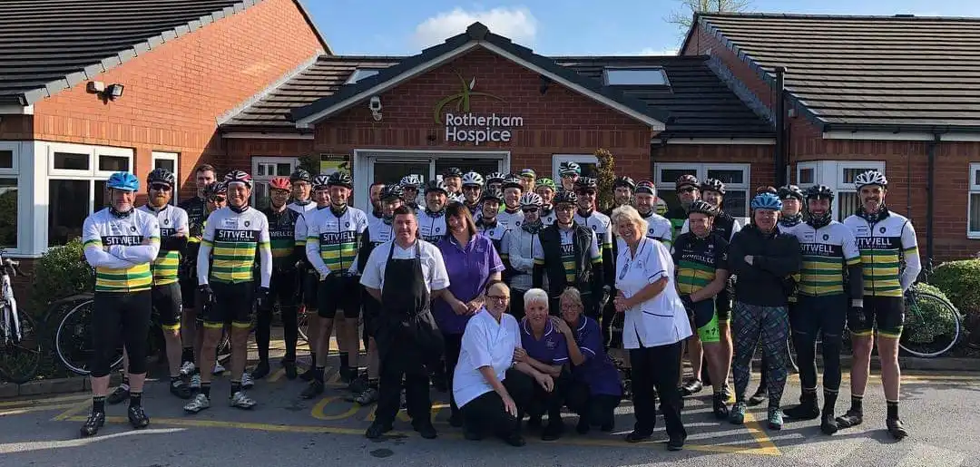A landscape photograph of Club members outside Rotherham Hospice